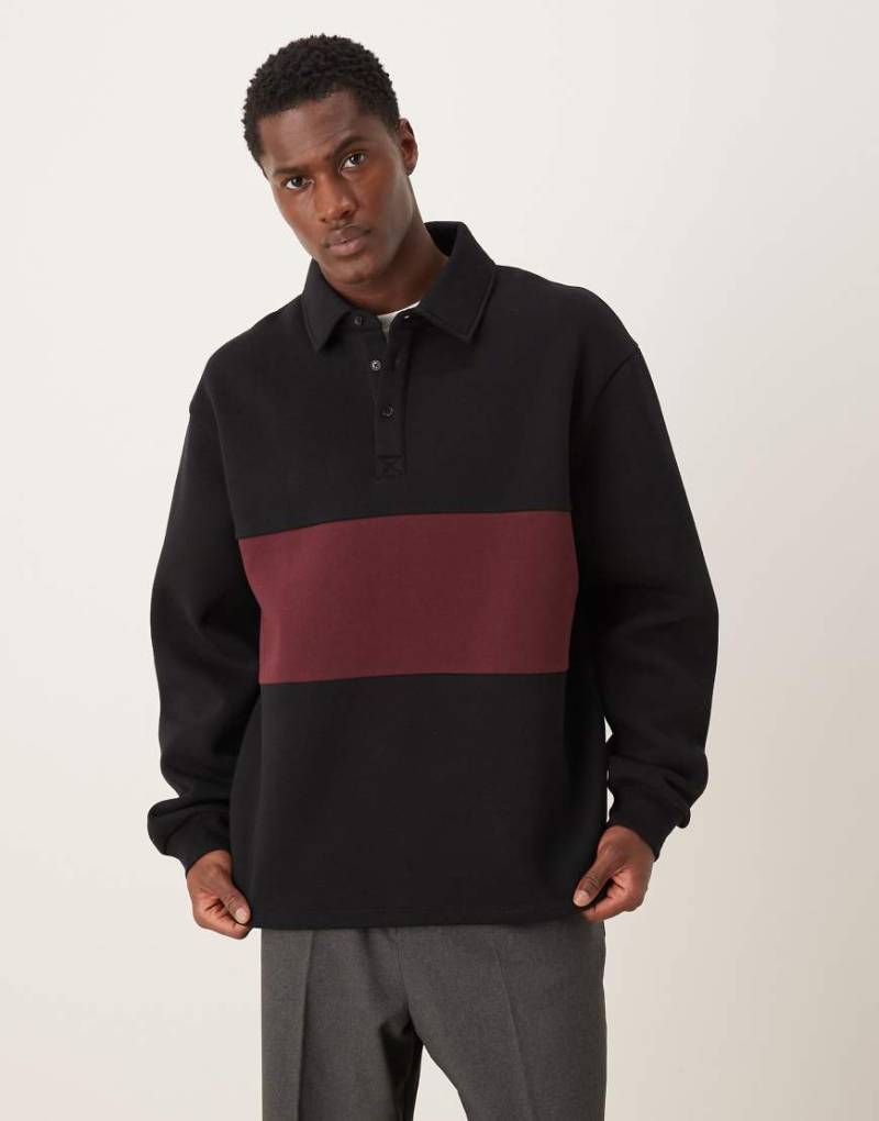 ASOS DESIGN - Polo-Sweatshirt in Schwarz mit Kontrasteinsätzen in Relaxed-Fit-Passform von ASOS DESIGN