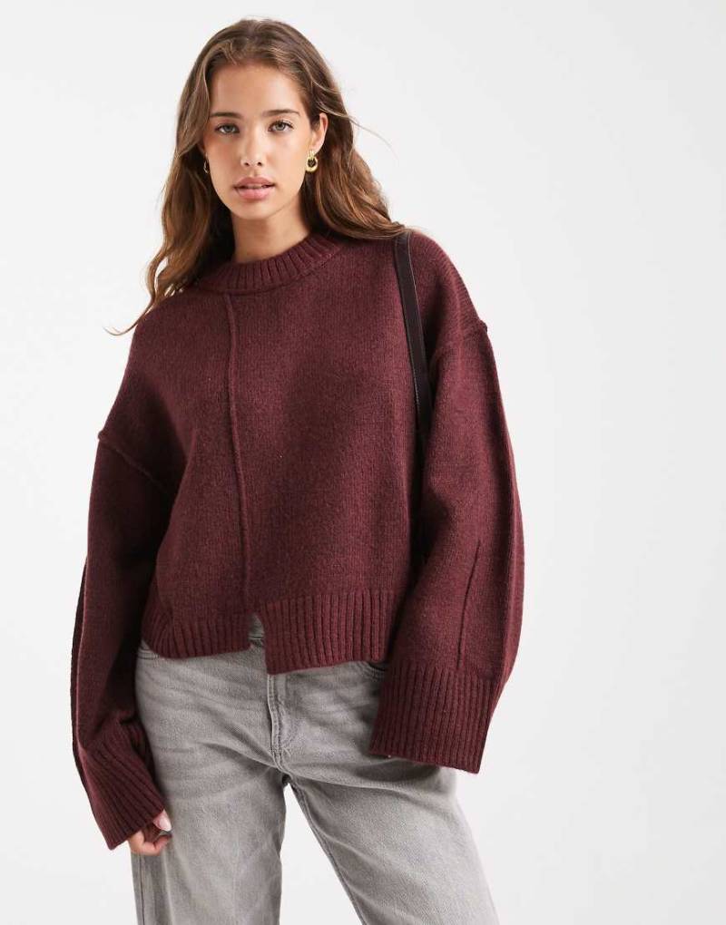 ASOS DESIGN - Pullover in Pflaume mit Rundhalsausschnitt, Nahtdetail vorne und gestepptem Saum-Lila von ASOS DESIGN
