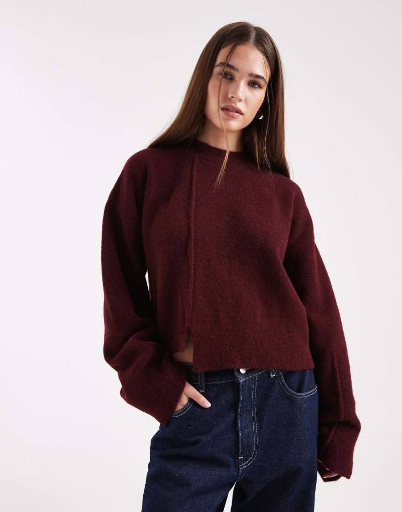 ASOS DESIGN - Pullover in Pflaume mit Rundhalsausschnitt, Nahtdetail vorne und gestepptem Saum-Lila von ASOS DESIGN