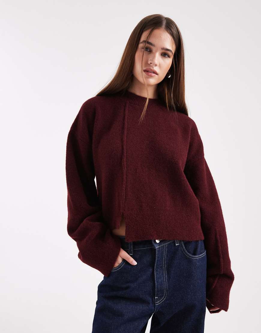 ASOS DESIGN - Pullover in Pflaume mit Rundhalsausschnitt, Nahtdetail vorne und gestepptem Saum-Lila von ASOS DESIGN