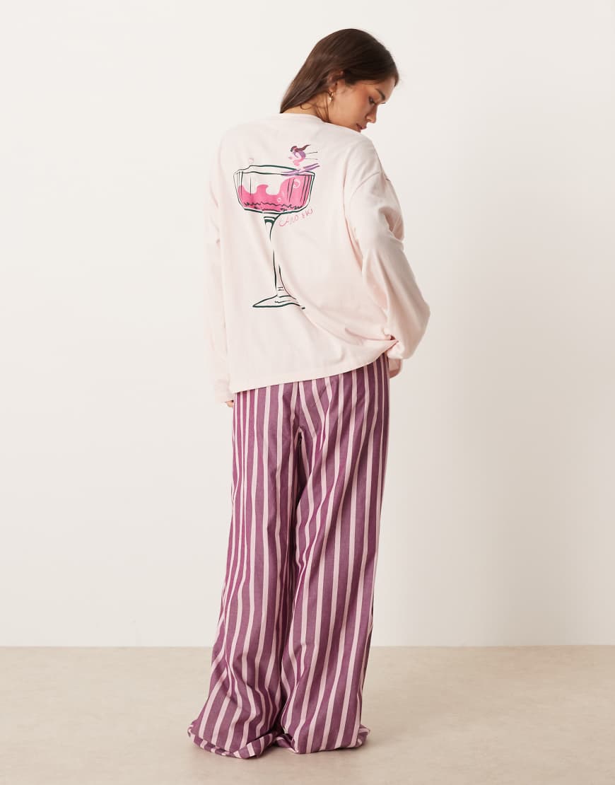 ASOS DESIGN - Pyjama aus langärmligem Shirt mit übergroßem Cocktail-Print und rosa gestreifter Hose mit weitem Bein von ASOS DESIGN