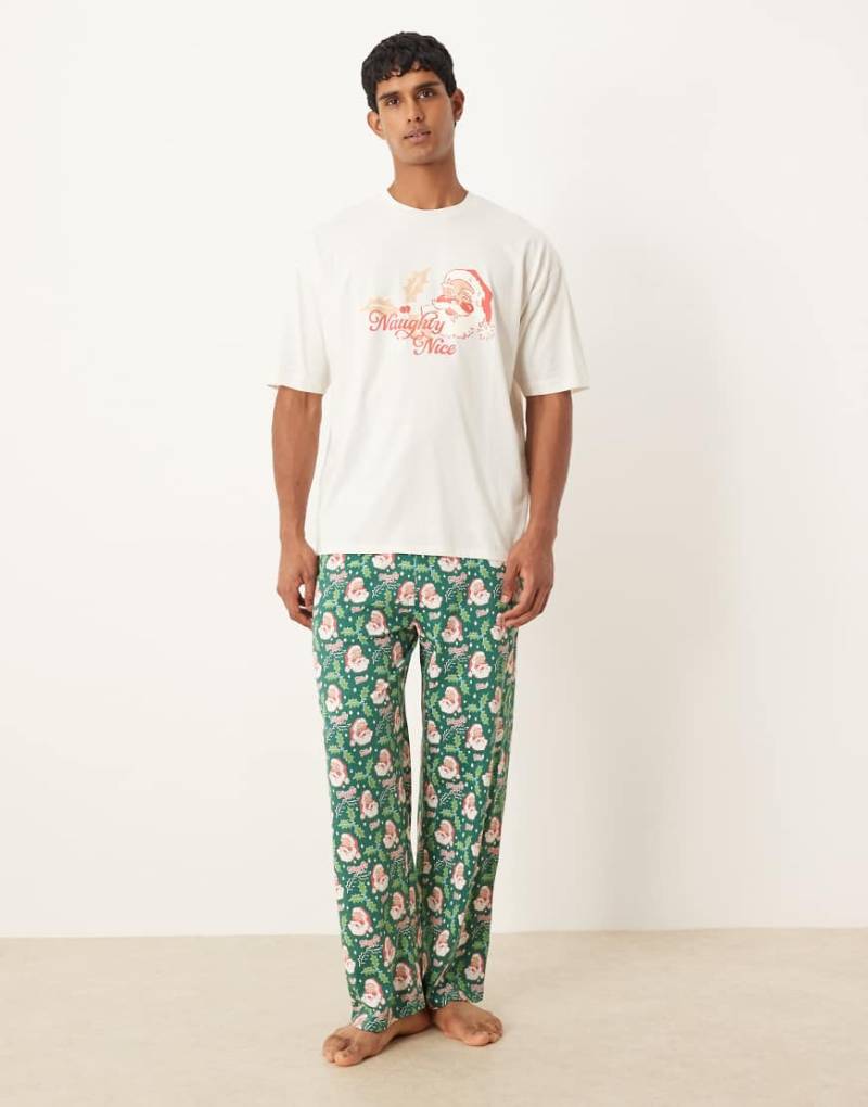 ASOS DESIGN - Pyjama in Blau mit Weihnachtsmann-Grafik im Retro-Design-Grün von ASOS DESIGN
