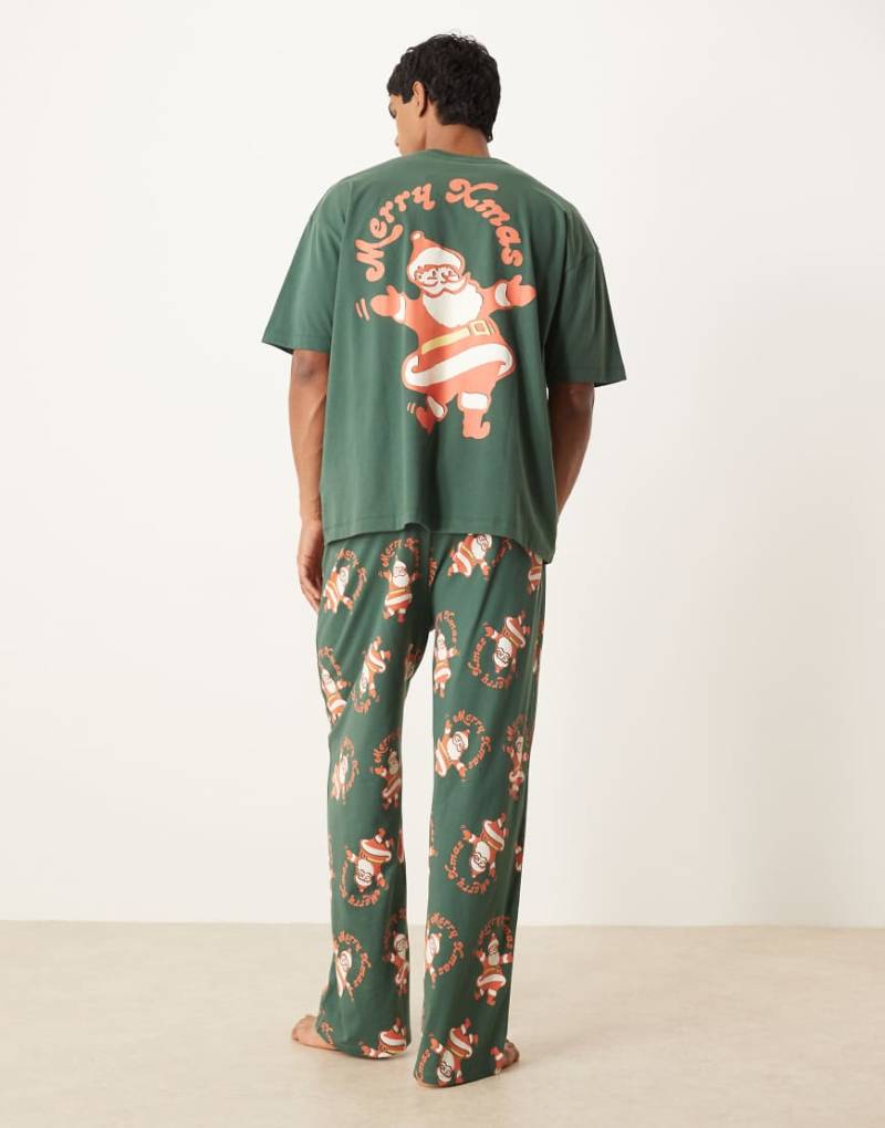 ASOS DESIGN - Pyjama in Grün mit Weihnachtsmann-Grafik im Vintage-Design von ASOS DESIGN