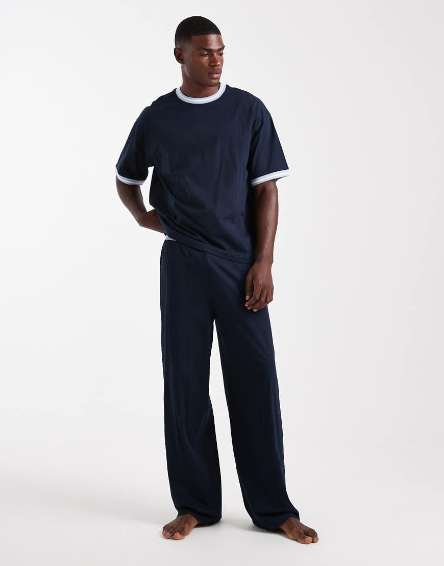 ASOS DESIGN - Pyjama in Marineblau mit kontrastierender Einfassung und weitem Bein von ASOS DESIGN