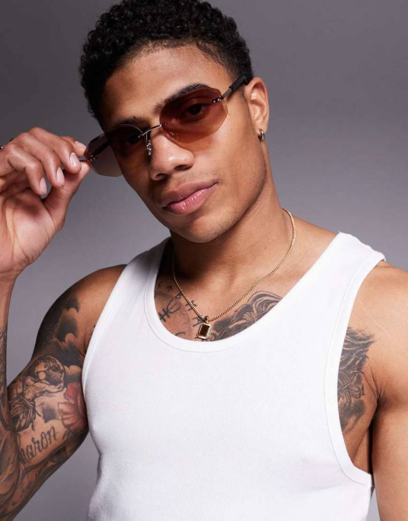 ASOS DESIGN - Randlose Sonnenbrille mit lila Gläsern und goldfarbenem Metallgestell von ASOS DESIGN