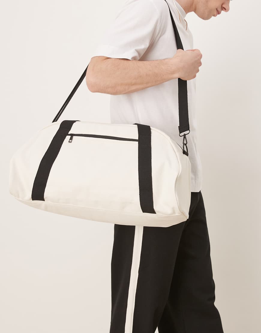 ASOS DESIGN - Reisetasche aus Canvas in Schwarz und Ecru-Weiß ASOS DESIGN - Reisetasche aus Canvas in Schwarz und Ecru-Weiß von ASOS DESIGN