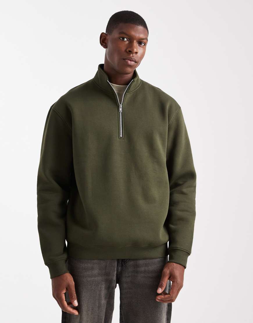 ASOS DESIGN - Relaxed Fit Basic-Sweatshirt in Grün mit kurzem Reißverschluss von ASOS DESIGN