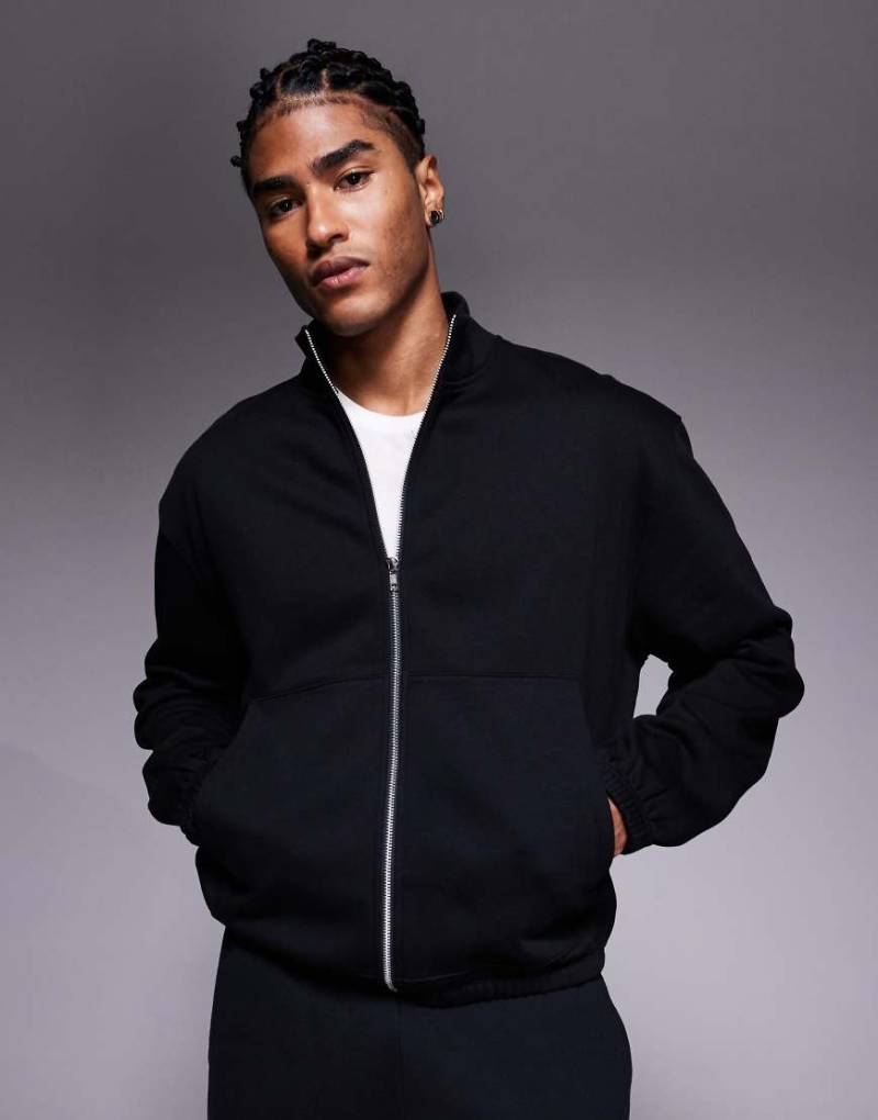 ASOS DESIGN - Relaxed Fit Jersey-Trainingsjacke in Schwarz mit Reißverschluss ASOS DESIGN - Relaxed Fit Jersey-Trainingsjacke in Schwarz mit Reißverschluss von ASOS DESIGN