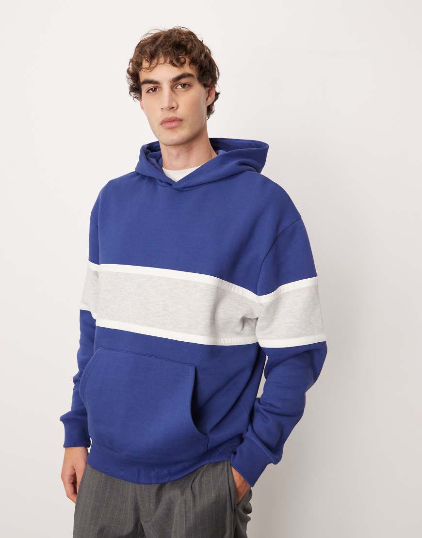 ASOS DESIGN - Relaxed-Fit-Kapuzenpullover mit Farbblockdesign in Marineblau-Grün von ASOS DESIGN
