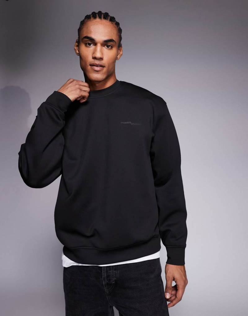 ASOS DESIGN - Relaxed-Fit-Pullover in Schwarz mit Rundhalsausschnitt und Printdetail von ASOS DESIGN