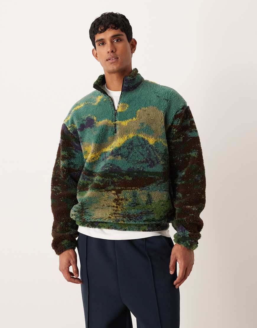ASOS DESIGN - Relaxed Fit Sweatshirt aus Teddyfell in Grün mit kurzem Reißverschluss und Landschaftsprint-Bunt von ASOS DESIGN