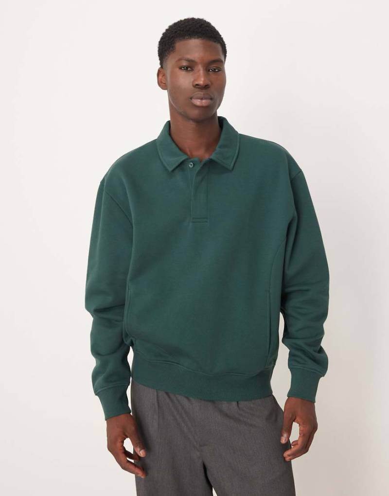 ASOS DESIGN - Relaxed-Fit-Sweatshirt in Dunkelgrün mit Polokragen von ASOS DESIGN