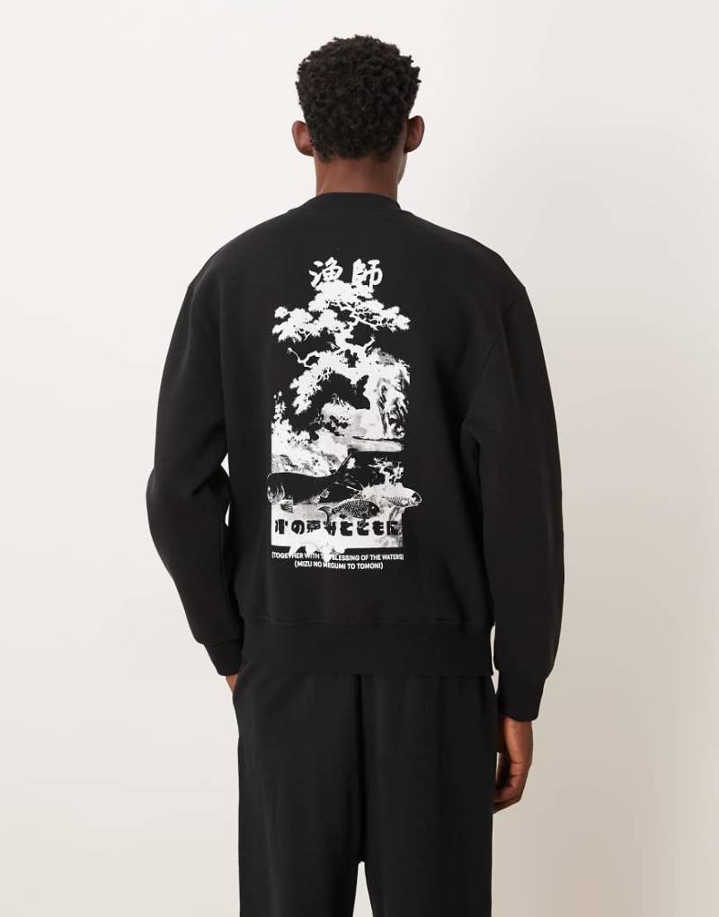 ASOS DESIGN - Relaxed-Fit-Sweatshirt in Schwarz mit Souvenir-Print von ASOS DESIGN