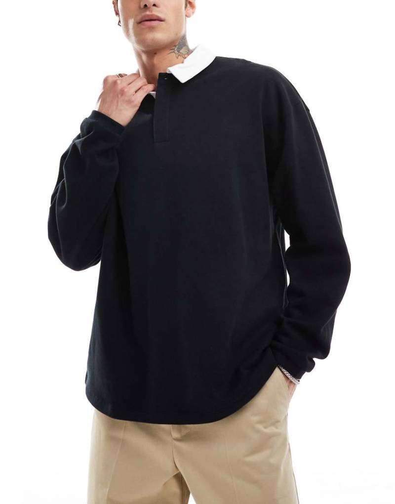 ASOS DESIGN - Rugby-Sweatshirt in Schwarz mit Oversize-Schnitt und Polokragen von ASOS DESIGN