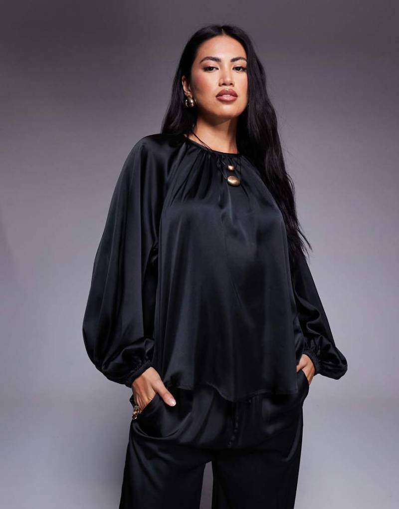 ASOS DESIGN - Satin-Bluse in Schwarz mit voluminösen Ärmeln ASOS DESIGN - Satin-Bluse in Schwarz mit voluminösen Ärmeln von ASOS DESIGN
