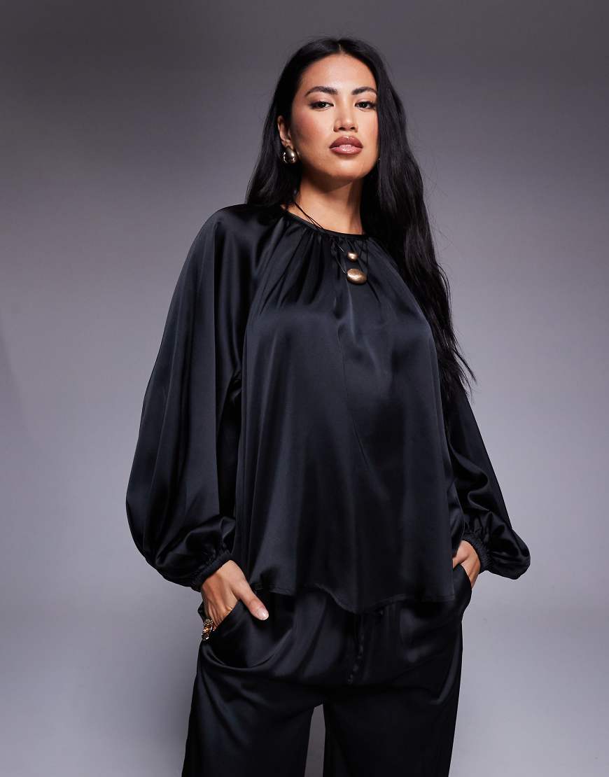 ASOS DESIGN - Satin-Bluse in Schwarz mit voluminösen Ärmeln ASOS DESIGN - Satin-Bluse in Schwarz mit voluminösen Ärmeln von ASOS DESIGN
