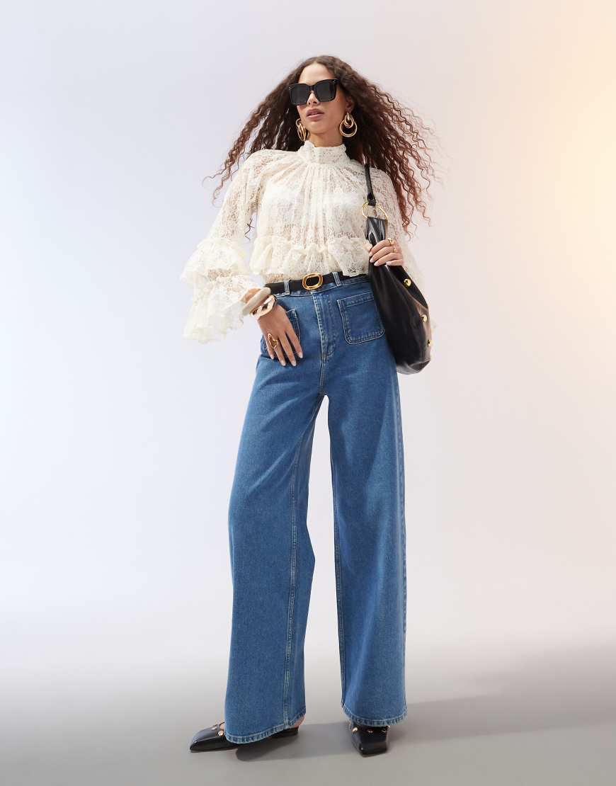 ASOS DESIGN - Schlichte Jeans in Mittelblau mit weitem Schnitt und Vordertaschen ASOS DESIGN - Schlichte Jeans in Mittelblau mit weitem Schnitt und Vordertaschen von ASOS DESIGN