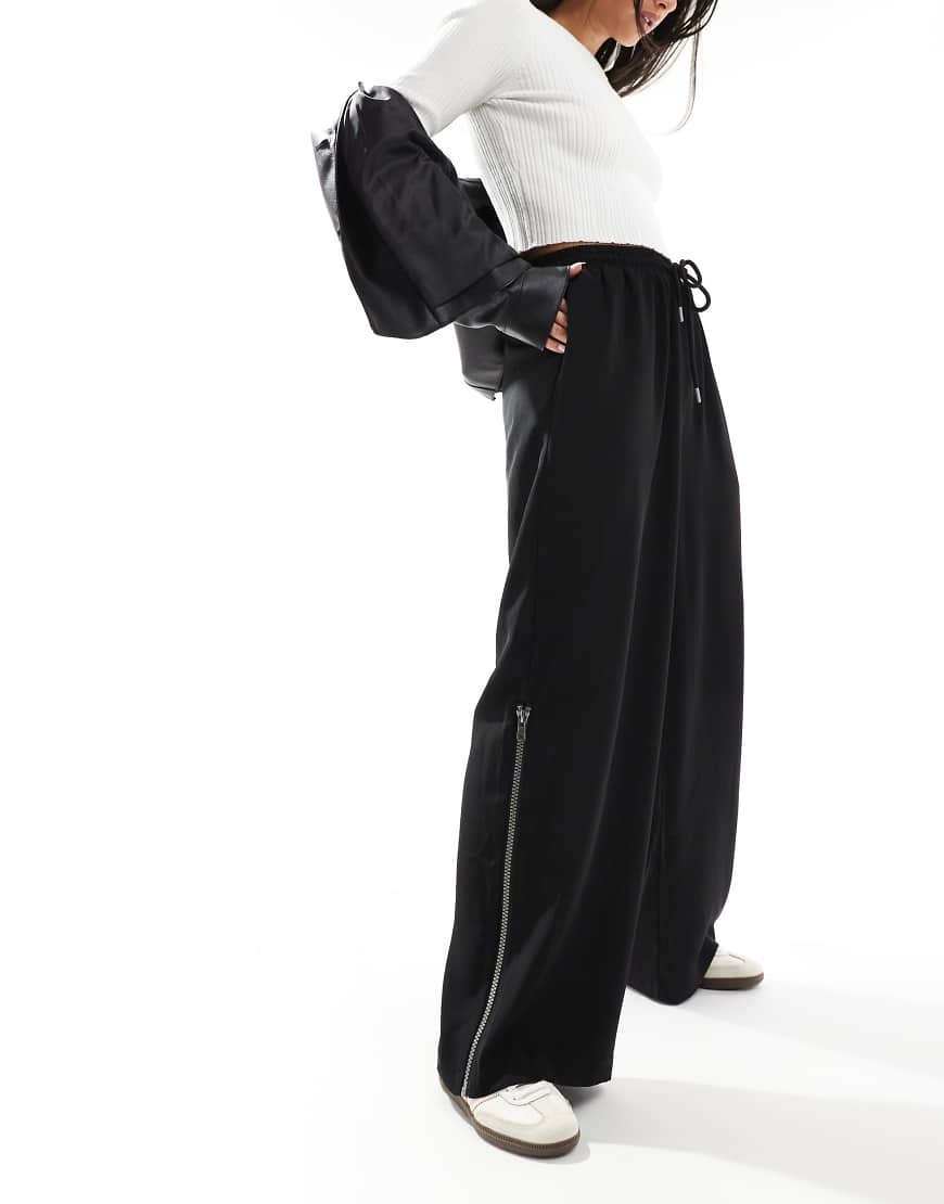 ASOS DESIGN - Schlupfhose in Schwarz mit seitlichem Reißverschlussdetail von ASOS DESIGN