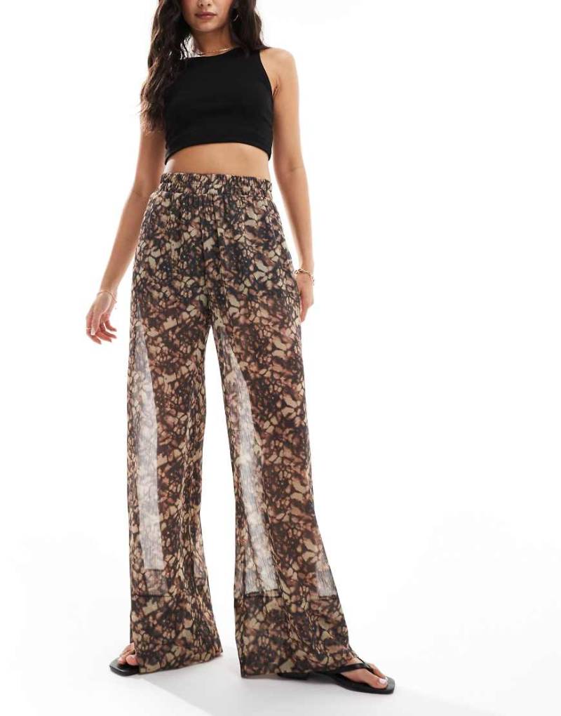 ASOS DESIGN - Schlupfhose mit durchscheinendem Overlay und abstraktem Print-Bunt von ASOS DESIGN