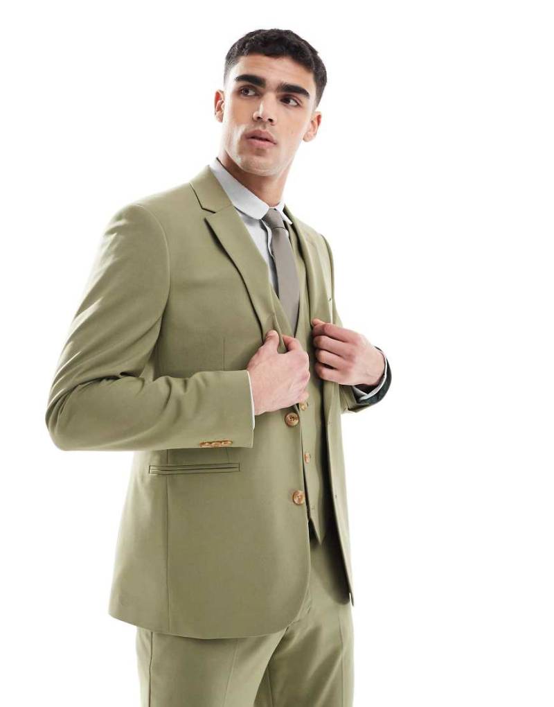 ASOS DESIGN - Schmal geschnittene Anzugjacke in Olivgrün ASOS DESIGN - Schmal geschnittene Anzugjacke in Olivgrün von ASOS DESIGN