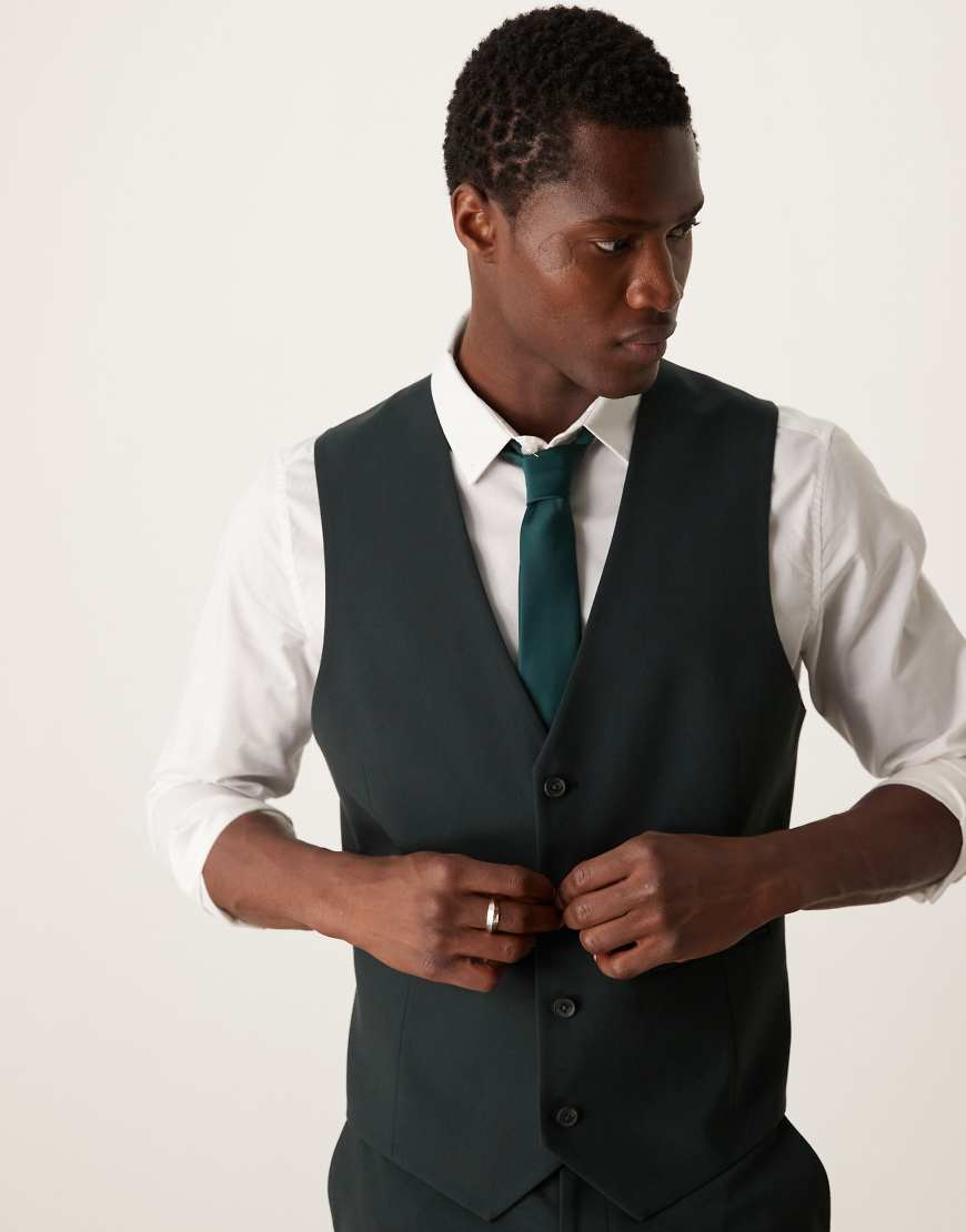 ASOS DESIGN - Schmal geschnittene Anzugweste in Dunkelgrün ASOS DESIGN - Schmal geschnittene Anzugweste in Dunkelgrün von ASOS DESIGN