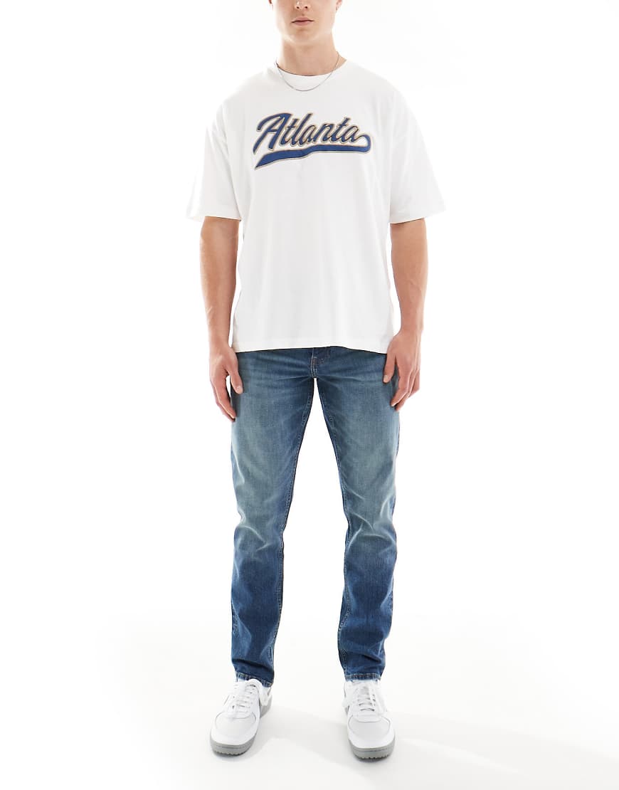 ASOS DESIGN - Schmal geschnittene Jeans in dunkelblauer Vintage-Waschung ASOS DESIGN - Schmal geschnittene Jeans in dunkelblauer Vintage-Waschung von ASOS DESIGN