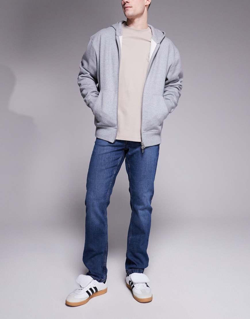ASOS DESIGN - Schmal geschnittene Jeans in dunkelblauer Waschung von ASOS DESIGN