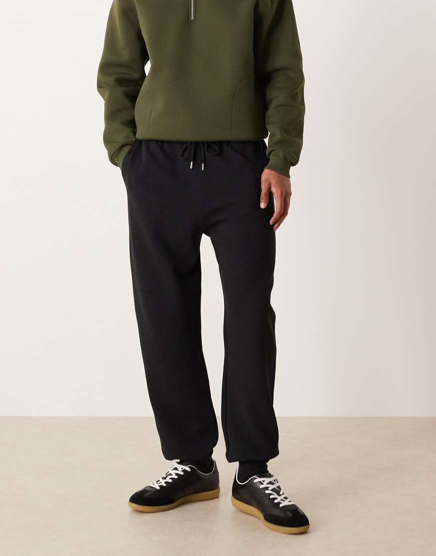 ASOS DESIGN - Schmal zulaufende, gerippte Jogginghose in Schwarz, Kombiteil von ASOS DESIGN