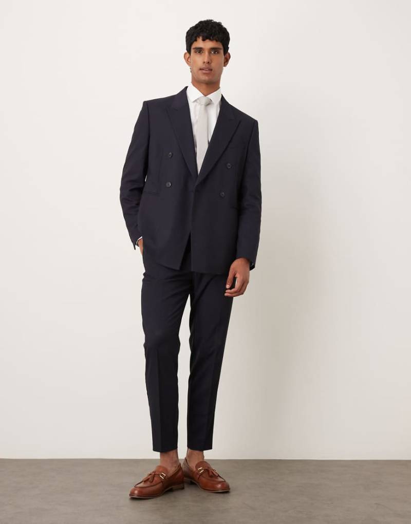 ASOS DESIGN - Schmal zulaufende Anzughose in Marineblau ASOS DESIGN - Schmal zulaufende Anzughose in Marineblau von ASOS DESIGN