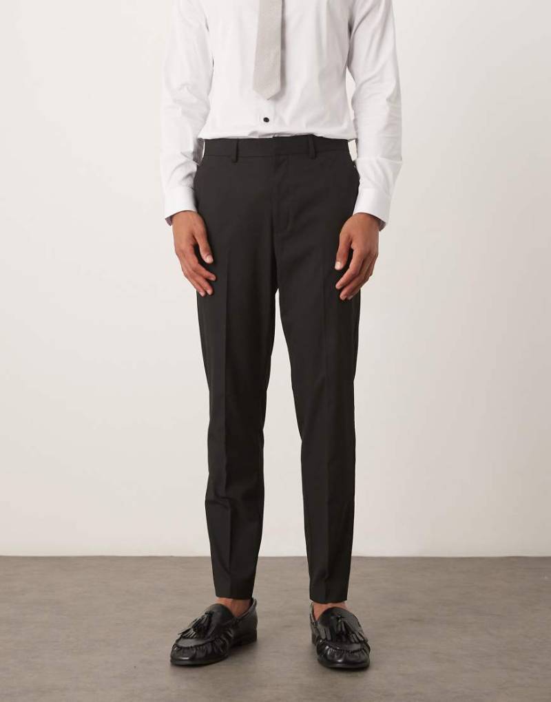 ASOS DESIGN - Schmal zulaufende Anzughose in Schwarz von ASOS DESIGN