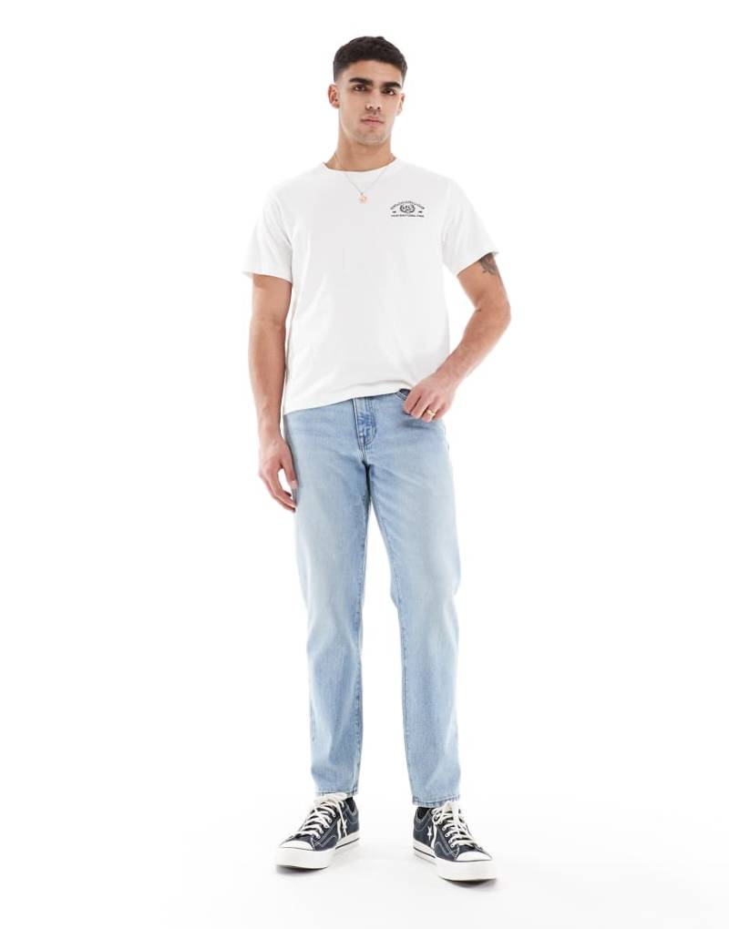 ASOS DESIGN - Schmal zulaufende Jeans in hellblauer Vintage-Waschung von ASOS DESIGN