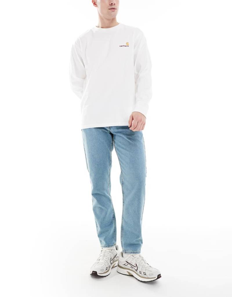 ASOS DESIGN - Schmal zulaufende Jeans in verwaschenem, getöntem Blau von ASOS DESIGN