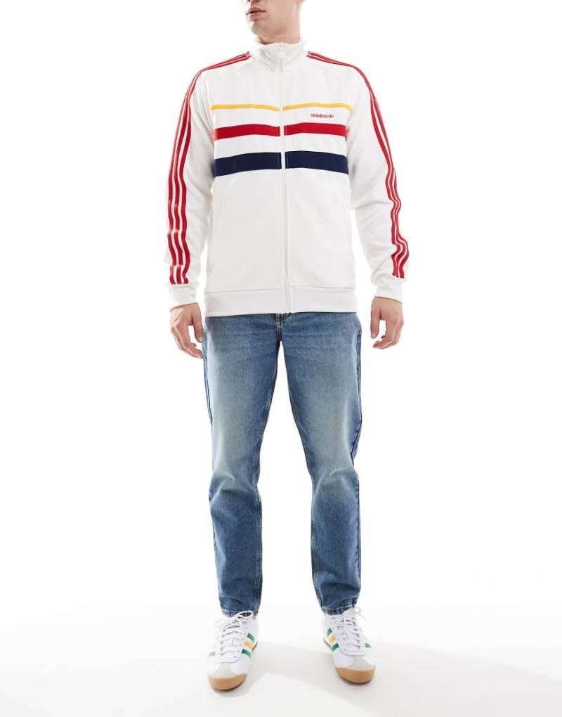 ASOS DESIGN - Schmal zulaufende Jeans in verwaschenem, getöntem Dunkelblau von ASOS DESIGN