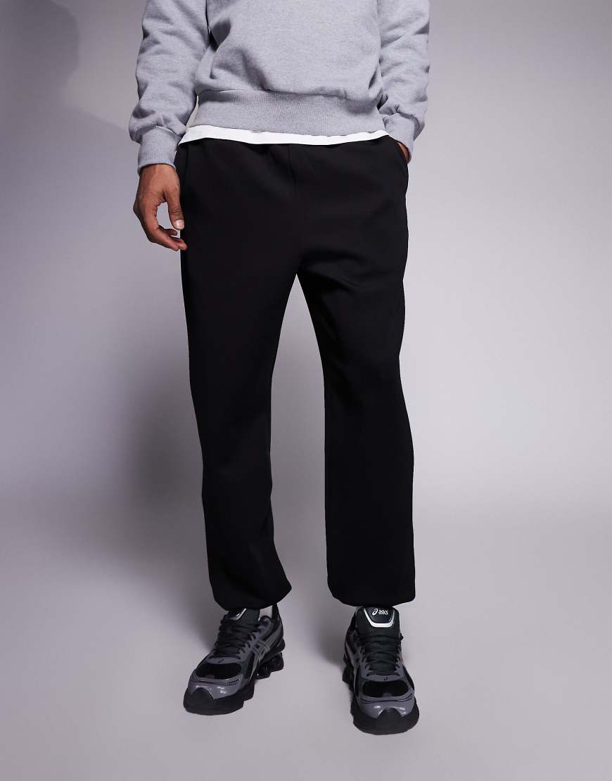 ASOS DESIGN - Schmal zulaufende Jogginghose in Schwarz von ASOS DESIGN