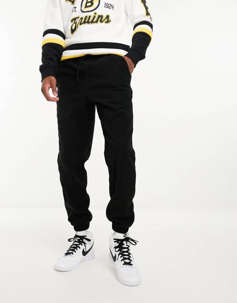ASOS DESIGN - Schmal zulaufende Jogginghose in Schwarz von ASOS DESIGN
