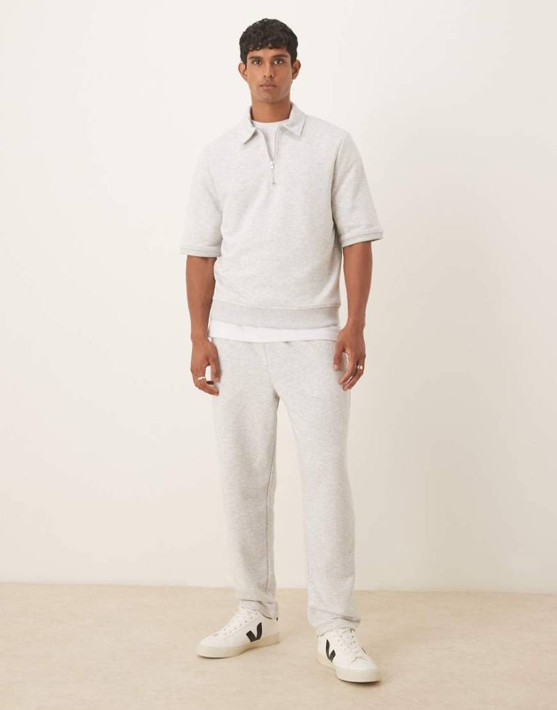 ASOS DESIGN - Schmal zulaufende Loopback-Jogginghose in meliertem Grau mit seitlichen Paspeln von ASOS DESIGN