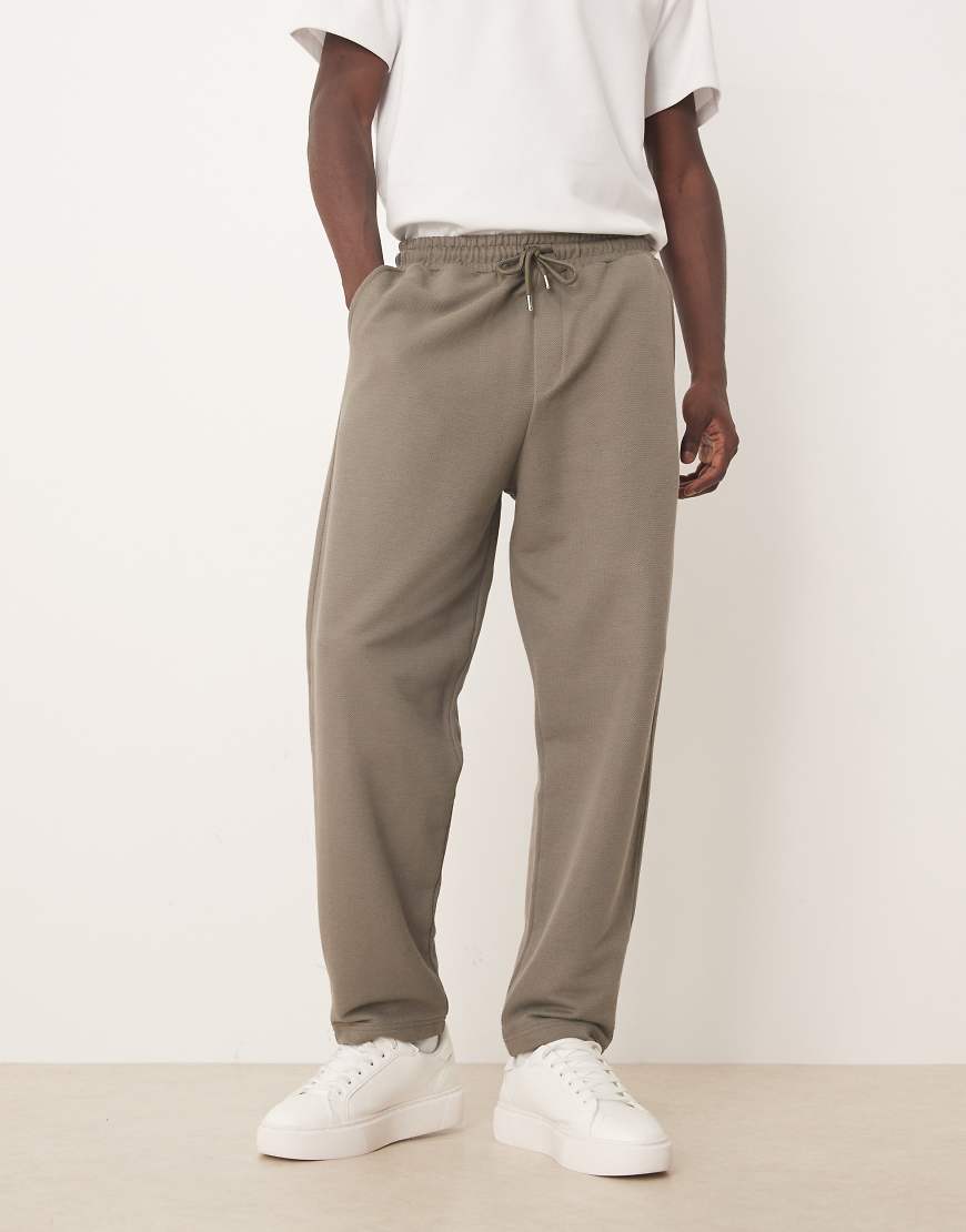 ASOS DESIGN - Schmal zulaufende Relaxed-Fit-Jogginghose aus Baumwollpikee in Khaki-Grün von ASOS DESIGN