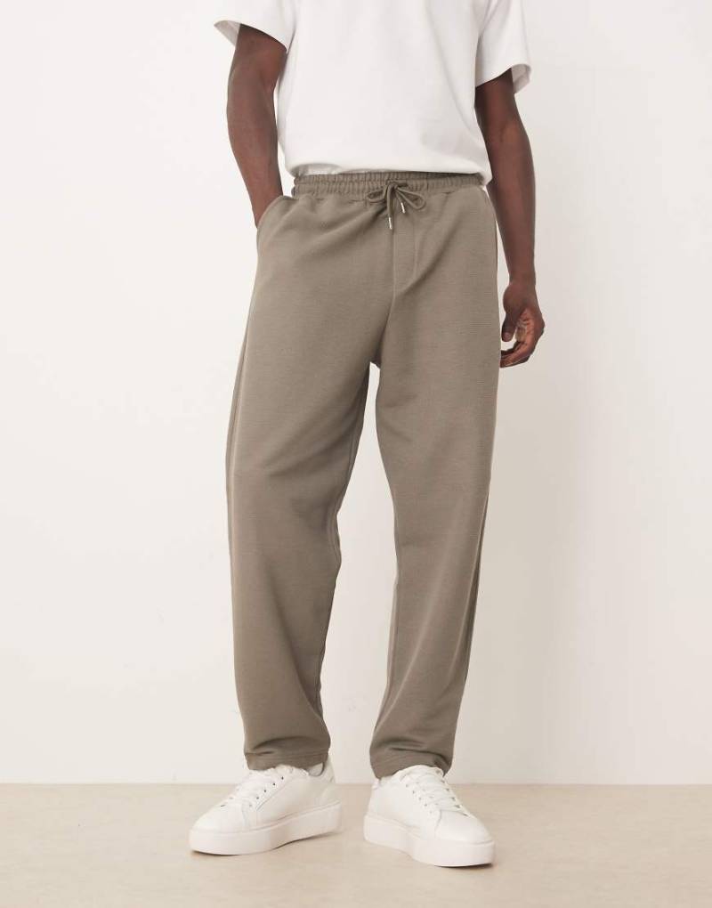 ASOS DESIGN - Schmal zulaufende Relaxed-Fit-Jogginghose aus Baumwollpikee in Khaki-Grün von ASOS DESIGN