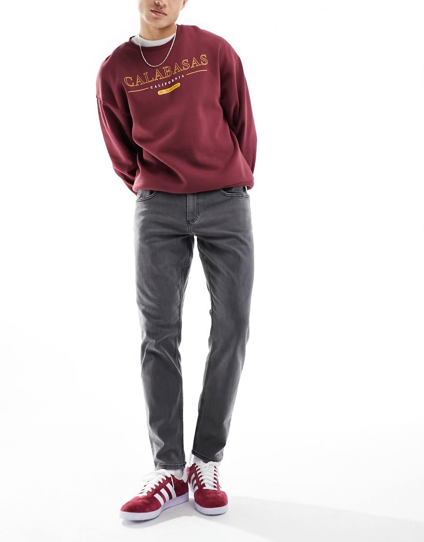 ASOS DESIGN - Schmal zulaufende Stretch-Jeans in Grau ASOS DESIGN - Schmal zulaufende Stretch-Jeans in Grau von ASOS DESIGN