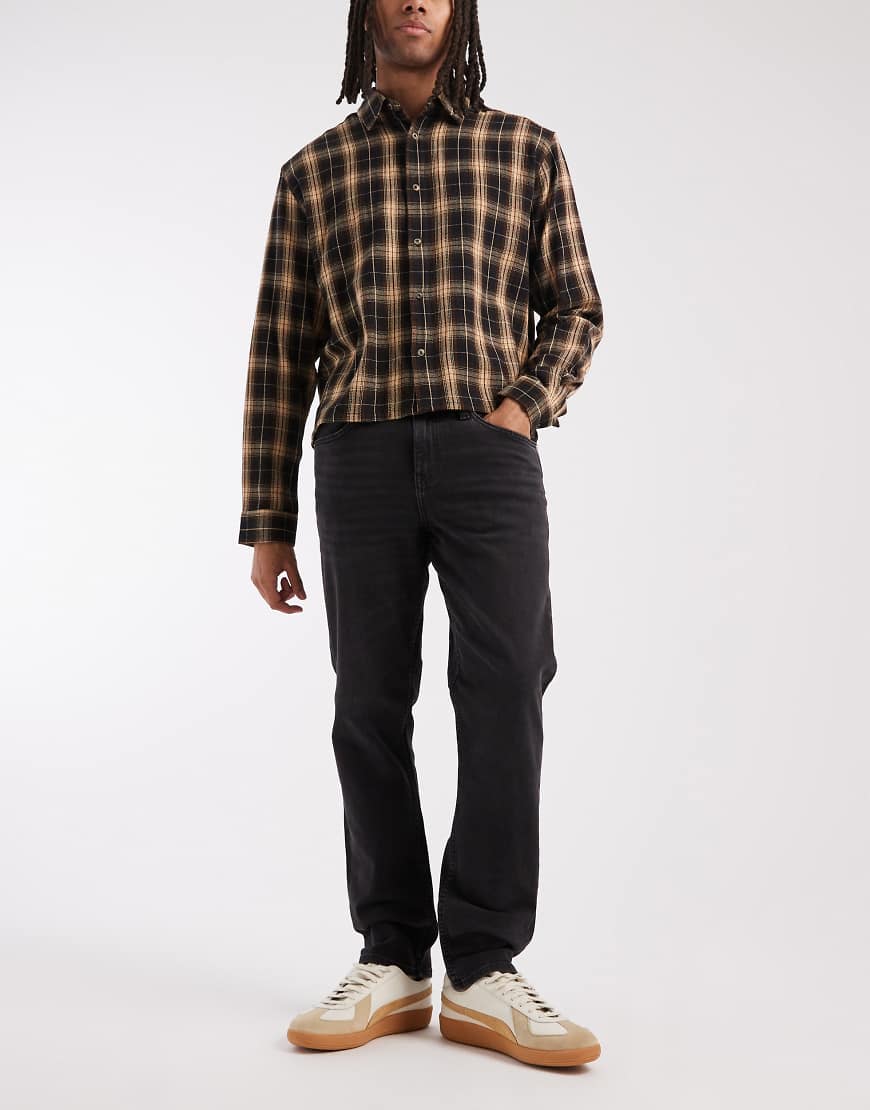 ASOS DESIGN - Schmale Stretch-Jeans in verwaschenem Schwarz von ASOS DESIGN