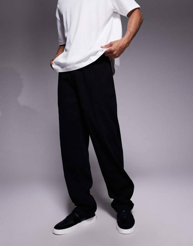 ASOS DESIGN - Schwere, schmal zulaufende Jogginghose in Schwarz mit fixiertem Saum und Biesen von ASOS DESIGN