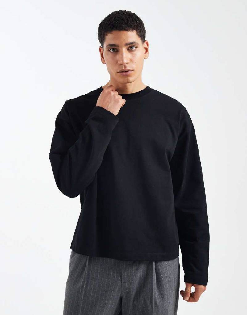 ASOS DESIGN - Kastiges, langärmliges Oversize-T-Shirt aus schwerem Material in Schwarz von ASOS DESIGN