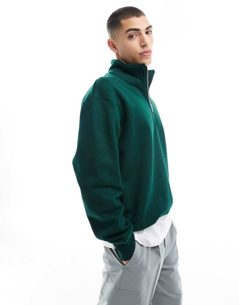 ASOS DESIGN - Schweres Oversize-Sweatshirt in Dunkelgrün mit halblangem Reißverschluss von ASOS DESIGN