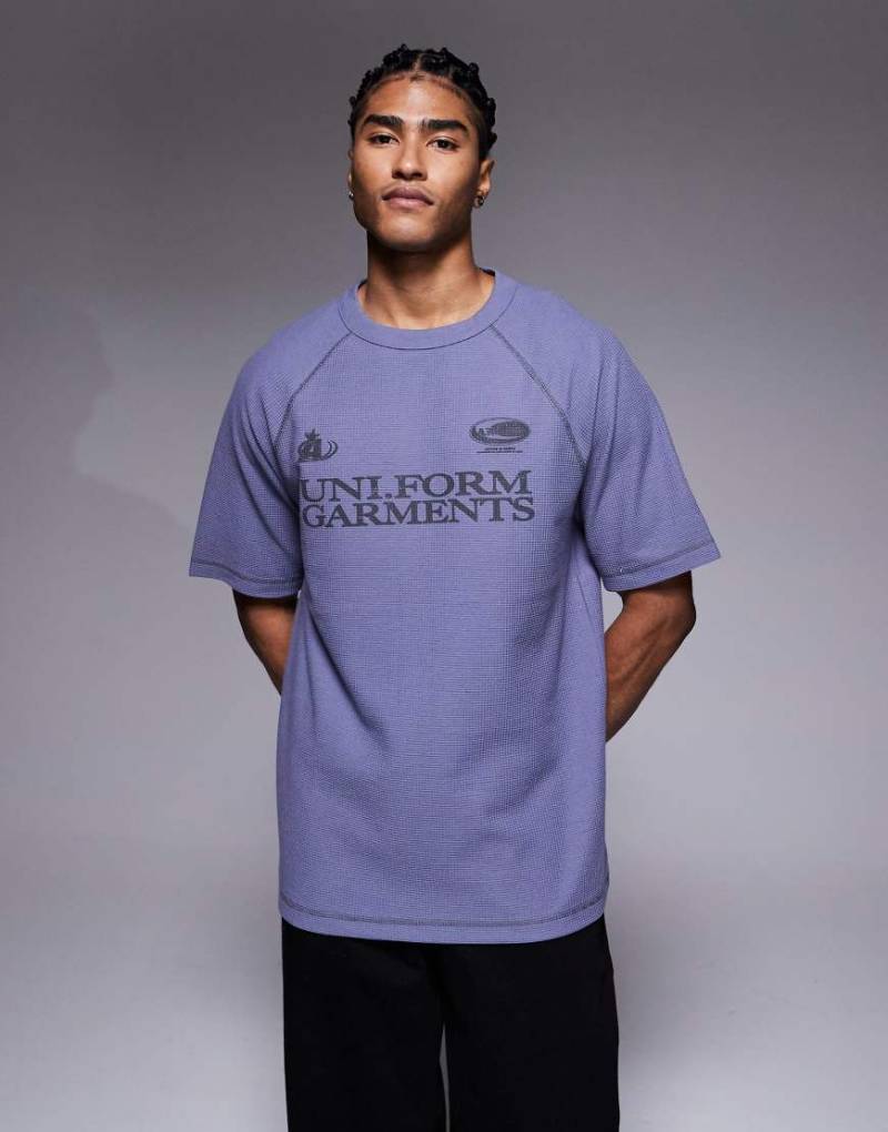 ASOS DESIGN - Schweres Raglan-T-Shirt mit Waffelstruktur und Textgrafik im Relaxed-Fit-Design-Blau von ASOS DESIGN