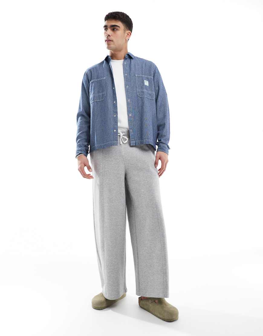 ASOS DESIGN - Sehr weite Jogginghose in meliertem Grau von ASOS DESIGN