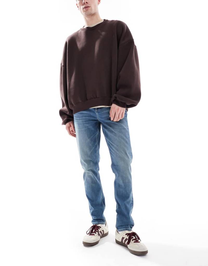 ASOS DESIGN - Skinny-Jeans in dunkelblauer Waschung mit grüner Tönung von ASOS DESIGN