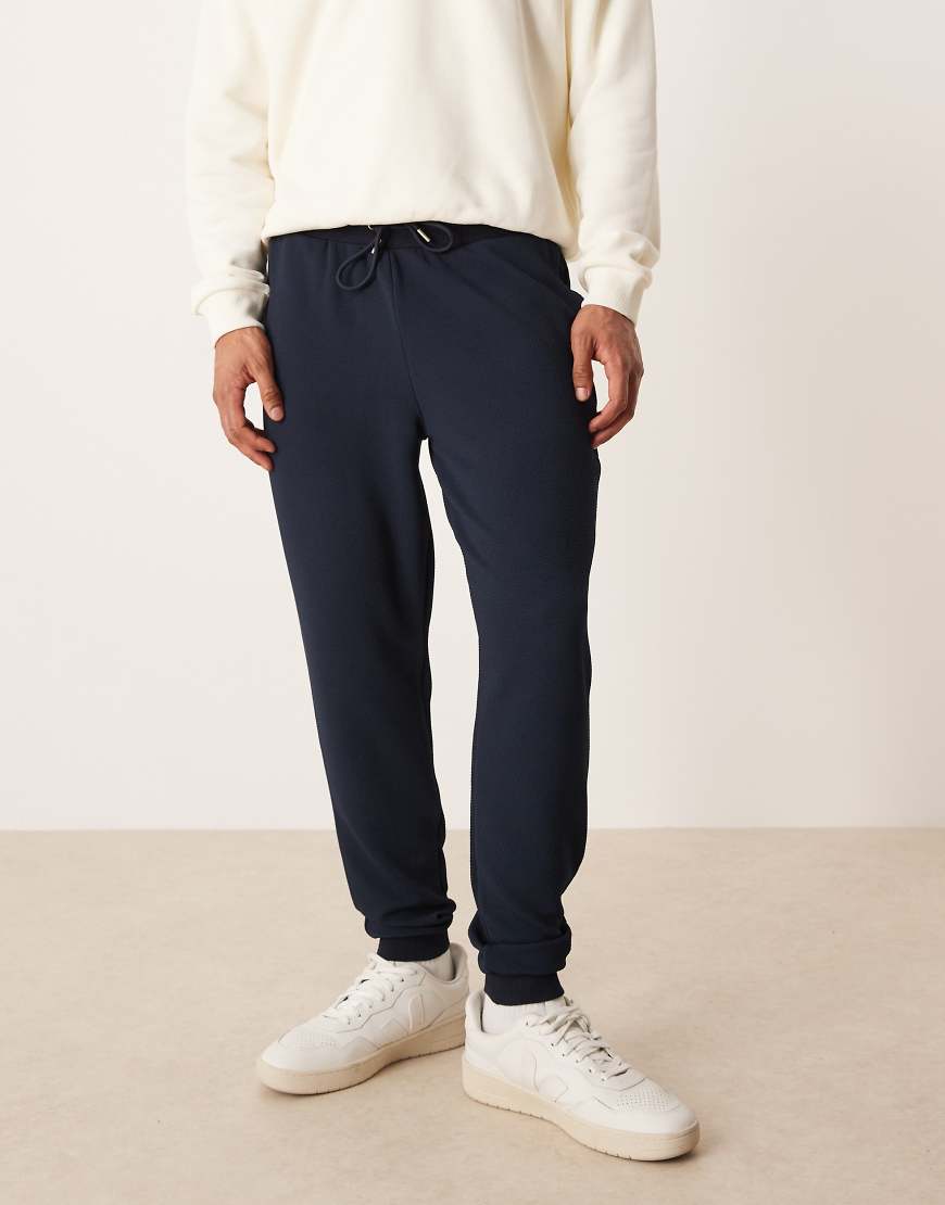 ASOS DESIGN - Slim-Fit-Jogginghose aus strukturiertem Jacquard in Marineblau von ASOS DESIGN