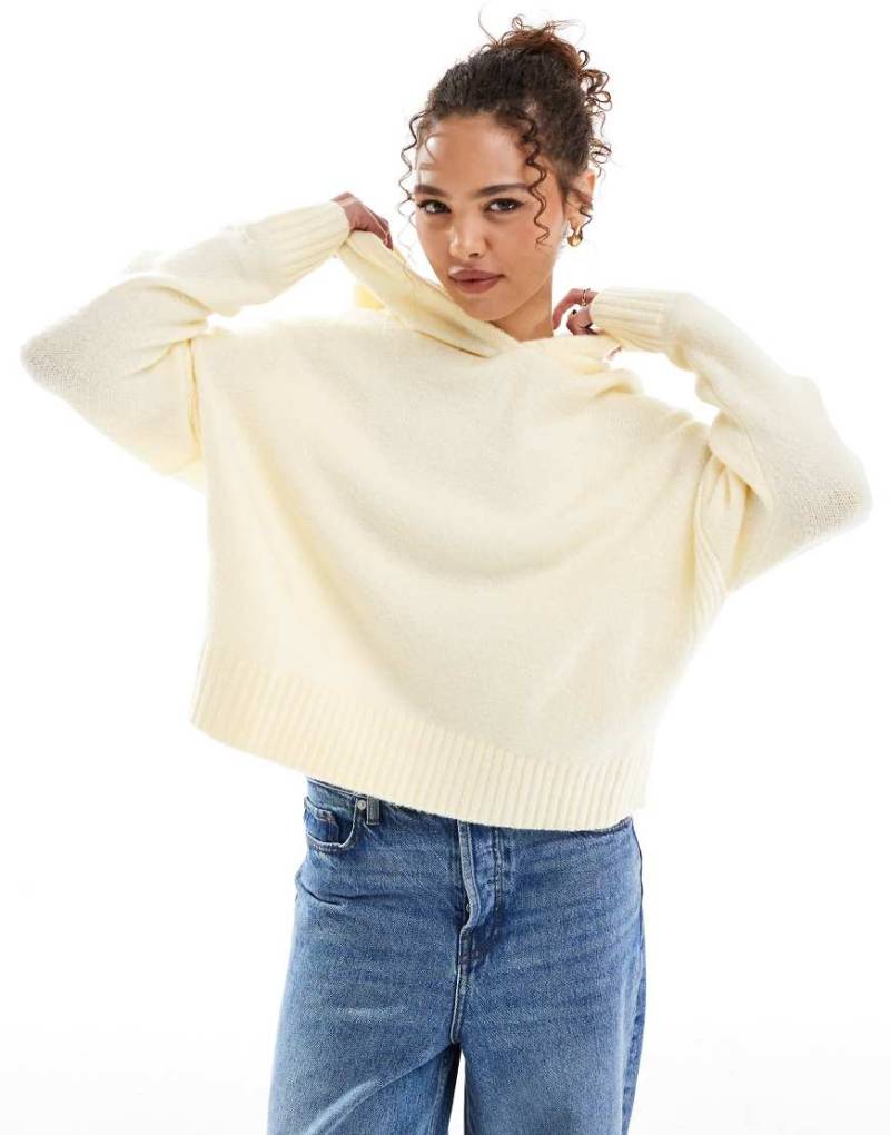 ASOS DESIGN - Strick-Kapuzenpullover in Buttermilch mit abgerundetem Saum-Gelb von ASOS DESIGN
