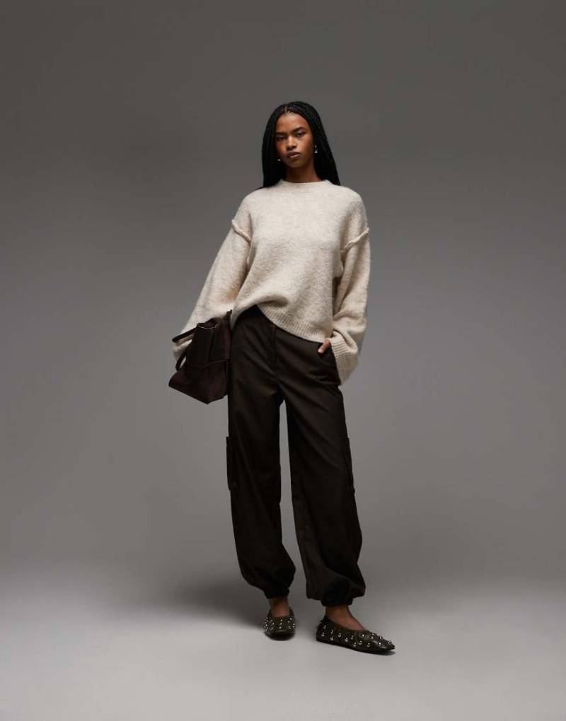 ASOS DESIGN - Strickpullover in Cremeweiß mit sichtbaren Nähten und Wollanteil von ASOS DESIGN