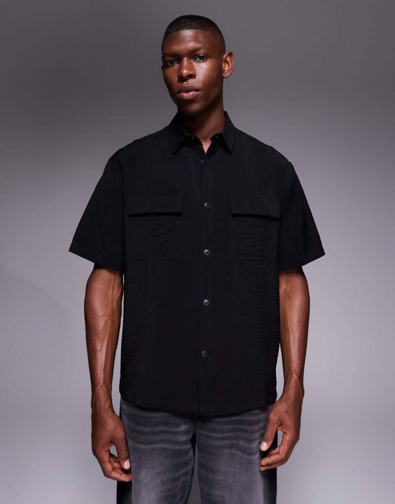 ASOS DESIGN - Strukturiertes Relaxed-Fit-T-Shirt in Schwarz von ASOS DESIGN